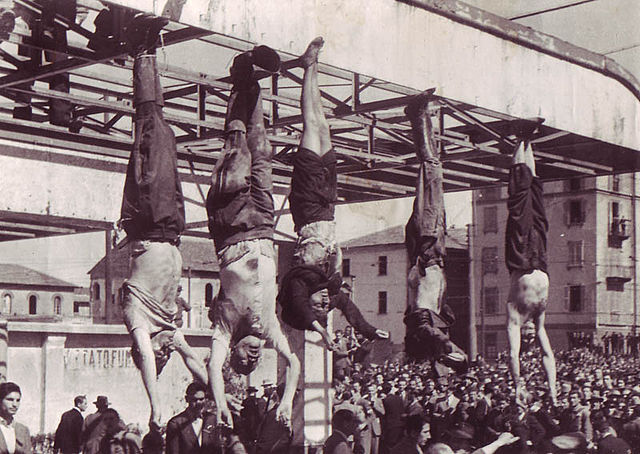Italian Dictator and Tyrant Benito Mussolini and his lieutenants hanging upside down in Milan in 1945 (Mussolini is second from left) ... (photo courtesy of Wikipedia, 2015) ...